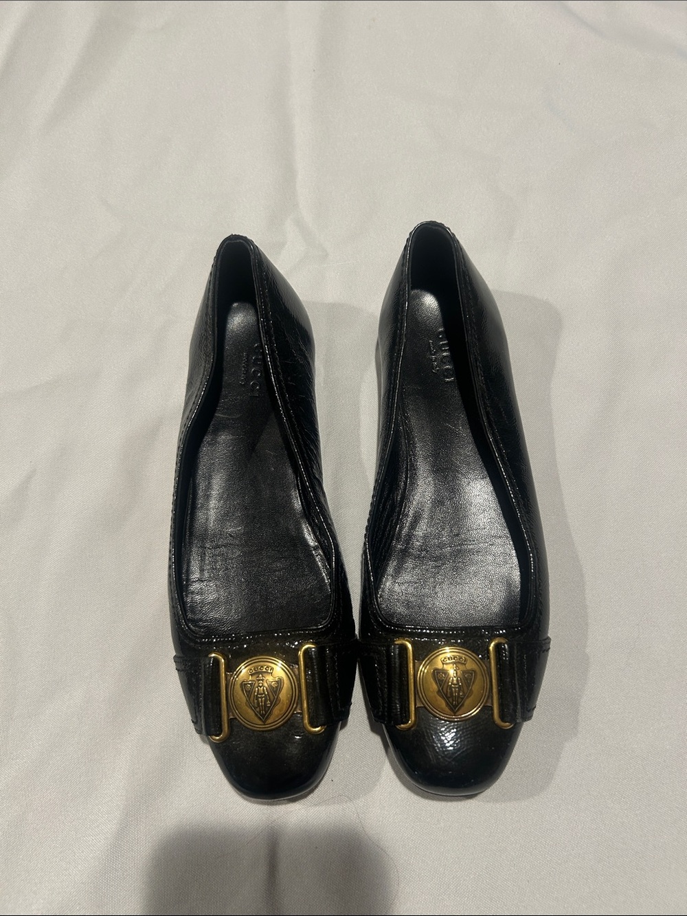 Gucci Black Leather Flats with Gold Logo Medallions